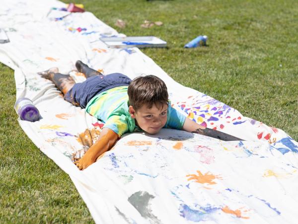 child on paint slip n slide